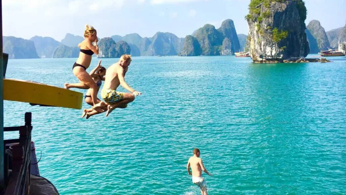Swimming directly from a cruise ship in Ao Ech Area's crystal-clear enclosed lagoon -- Lan Ha Bay's most unique open-water swimming experience