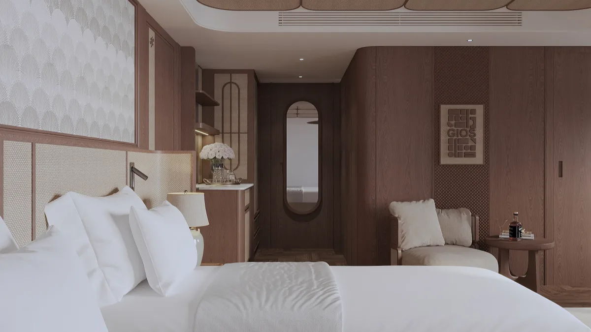 King bed and wardrobe in the Ocean View Suite – Harmony Boutique Cruise