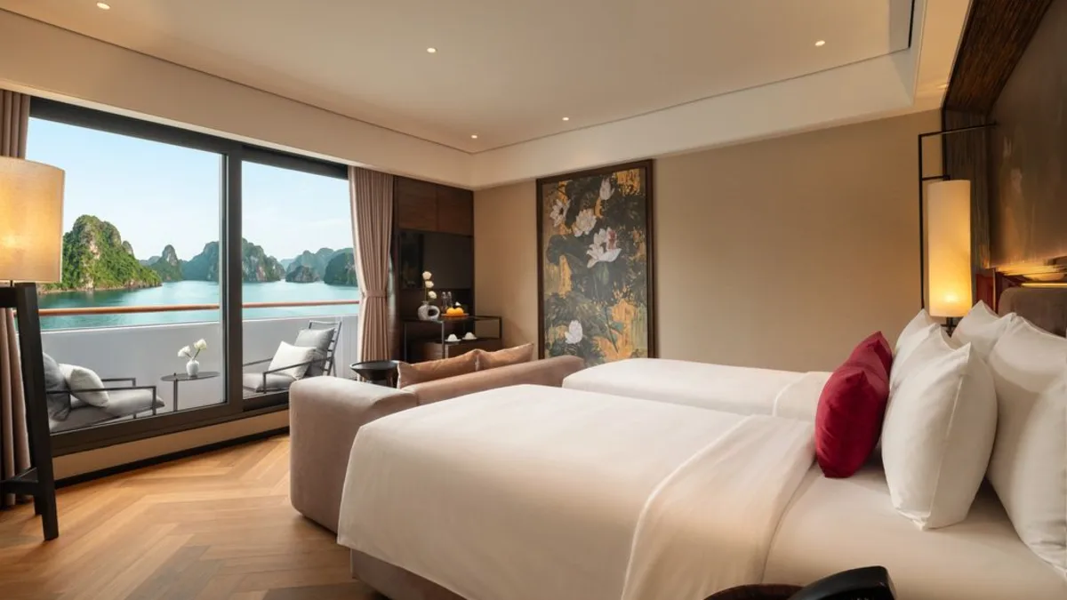 Bed facing the bay in the Ocean View Premier Suite on La SEN of the Bay Cruises