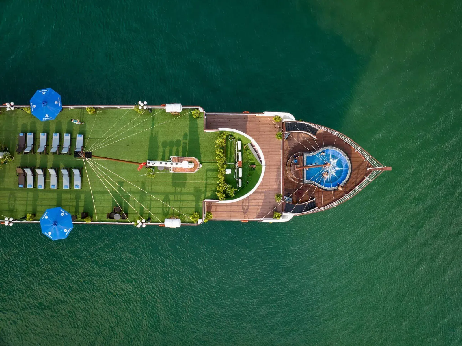 Aerial view of the sundeck and outdoor Jacuzzi pool on Le Journey Elegance Cruise, Lan Ha Bay