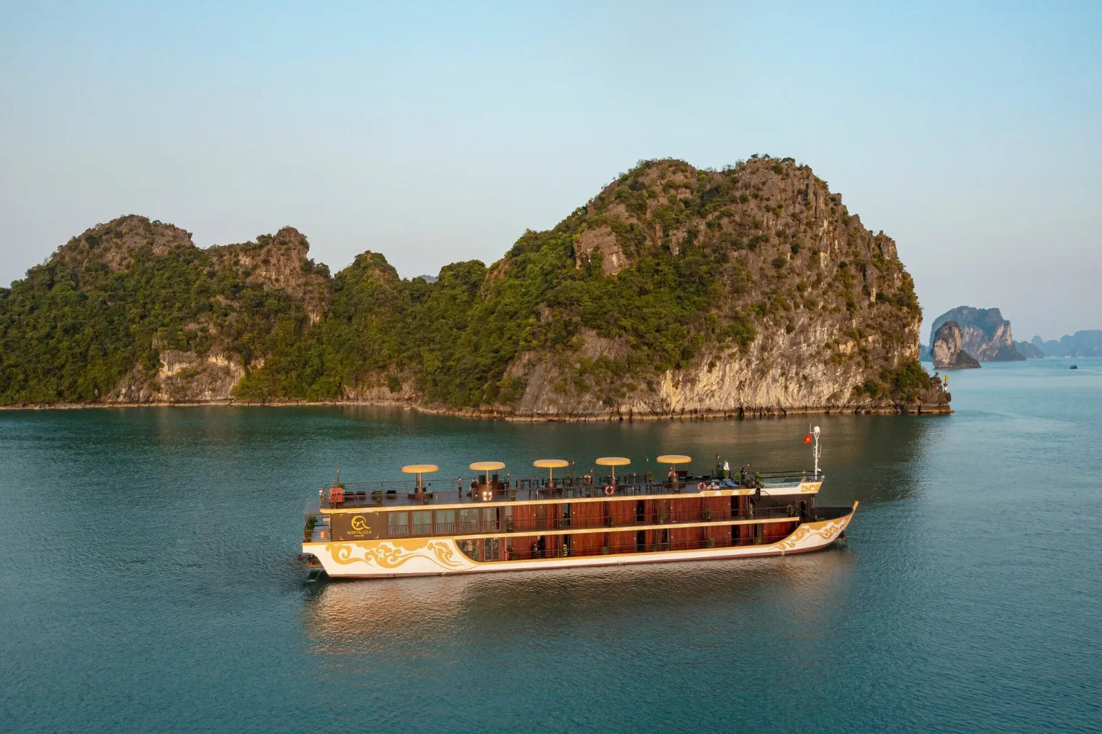 Nostalgia Cruise Ship Among Limestone Karsts