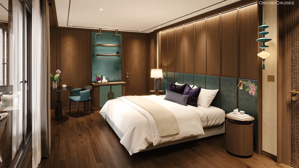 Suite Balcony on Orchid Luxury Cruise with king bed