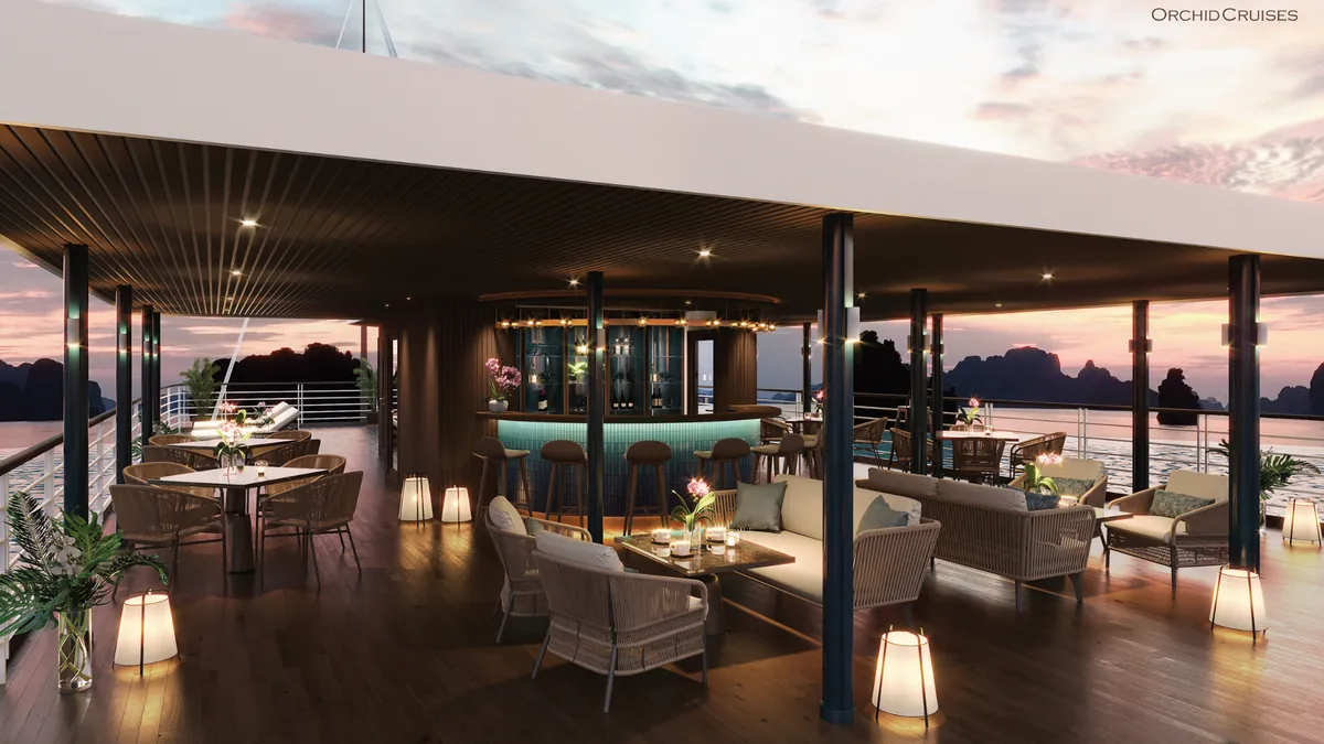 Orchid Luxury Cruise sundeck bar and terrace at sunset in Lan Ha Bay Orchid Luxury Cruise sundeck bar and terrace at sunset in Lan Ha Bay