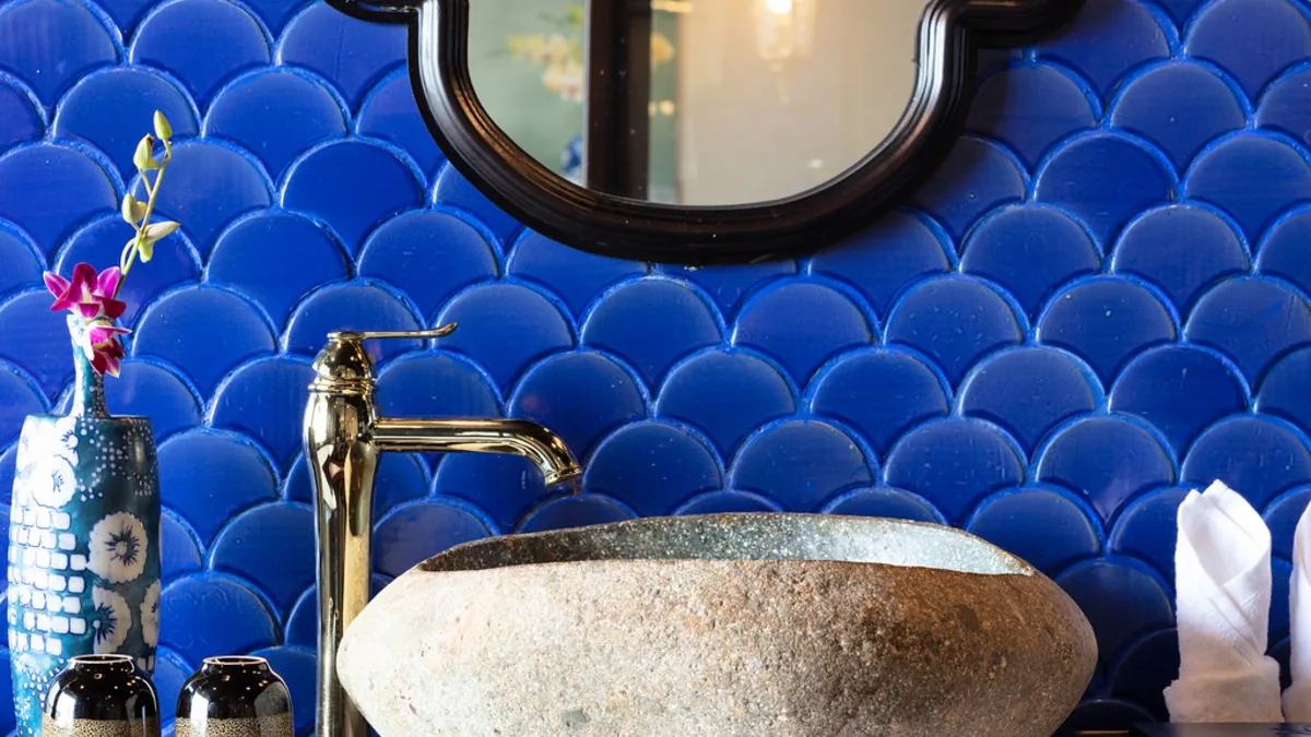 Stone basin and blue tiles in the Premium Terrace Suite bathroom
