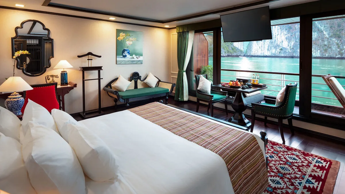 Premium Terrace Suite bed facing the bay on Orchid Premium Cruise