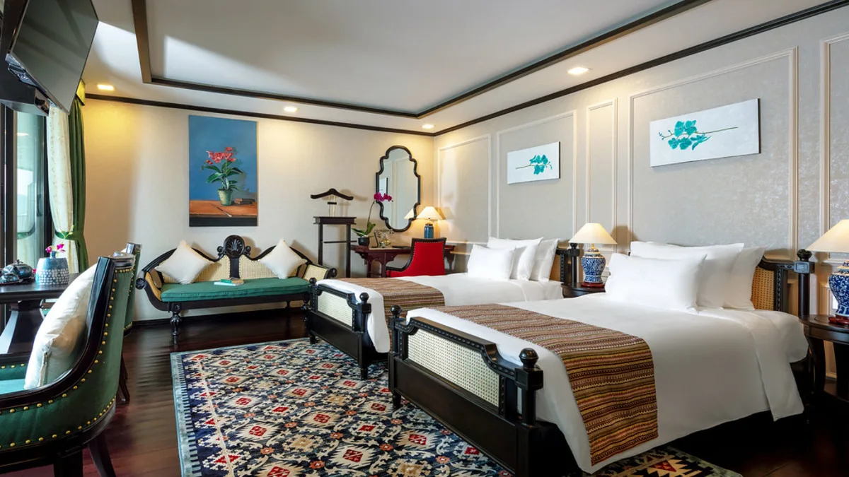 Terrace Suite with bed and sofa on Orchid Premium Cruise