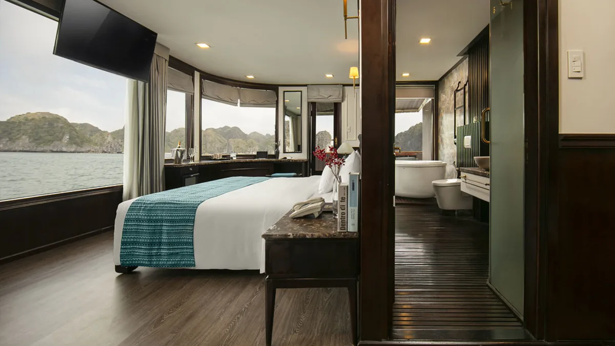 Double bed in the Exclusive Suite on Orchid Trendy Cruise
