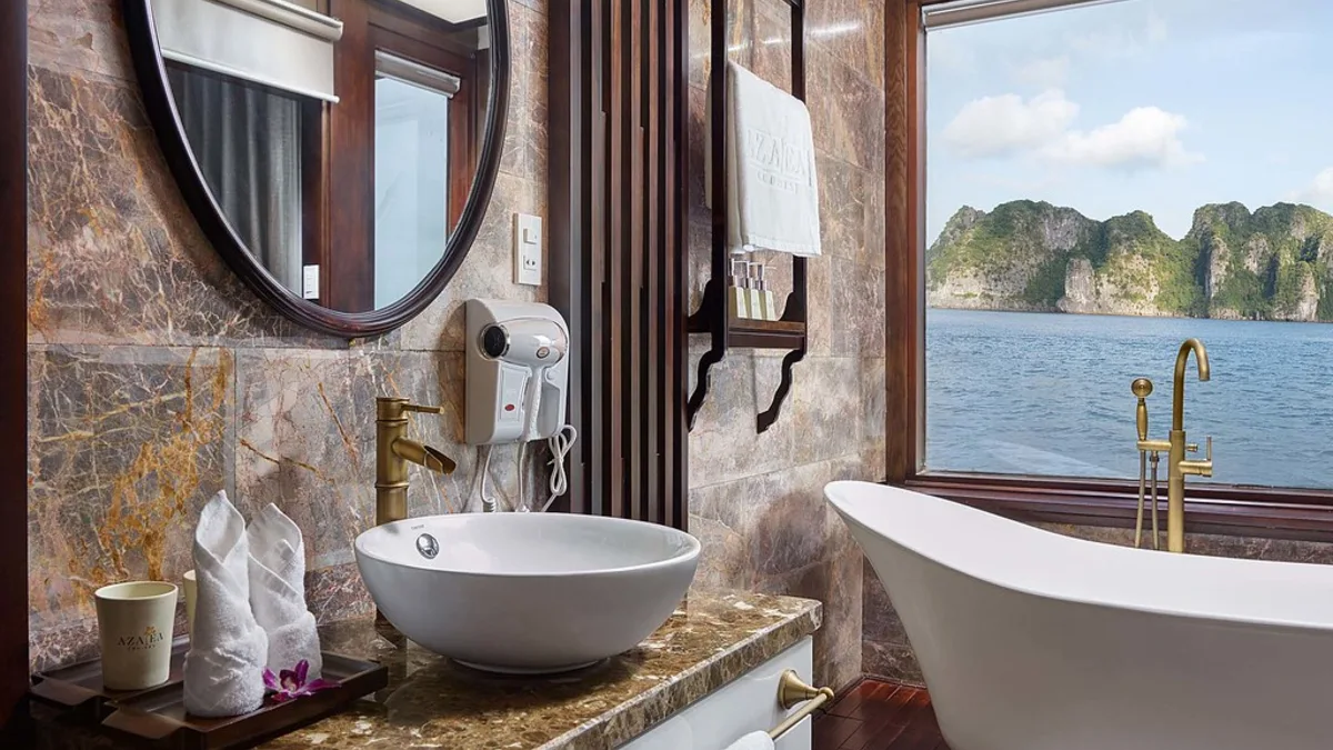 Bathroom with bathtub in a Premium Deluxe cabin on Orchid Trendy Cruise