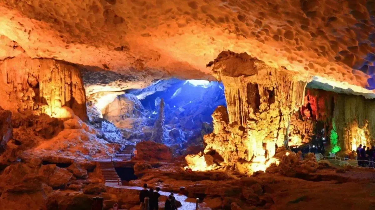 Sung Sot Cave third chamber "Royal Garden" — vast space with colorful lights, stalactites and stalagmites, Halong Bay Vietnam