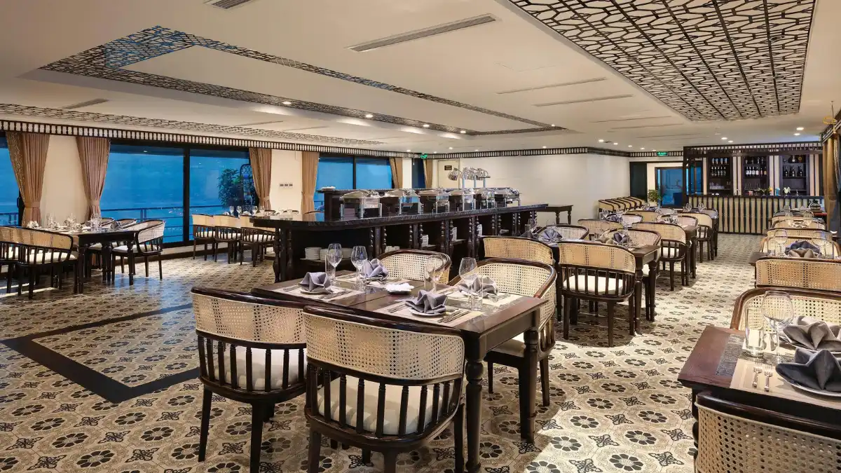 Venus Cruise Panorama Ocean Restaurant Panorama Ocean Restaurant on Venus Cruise with tables by large windows